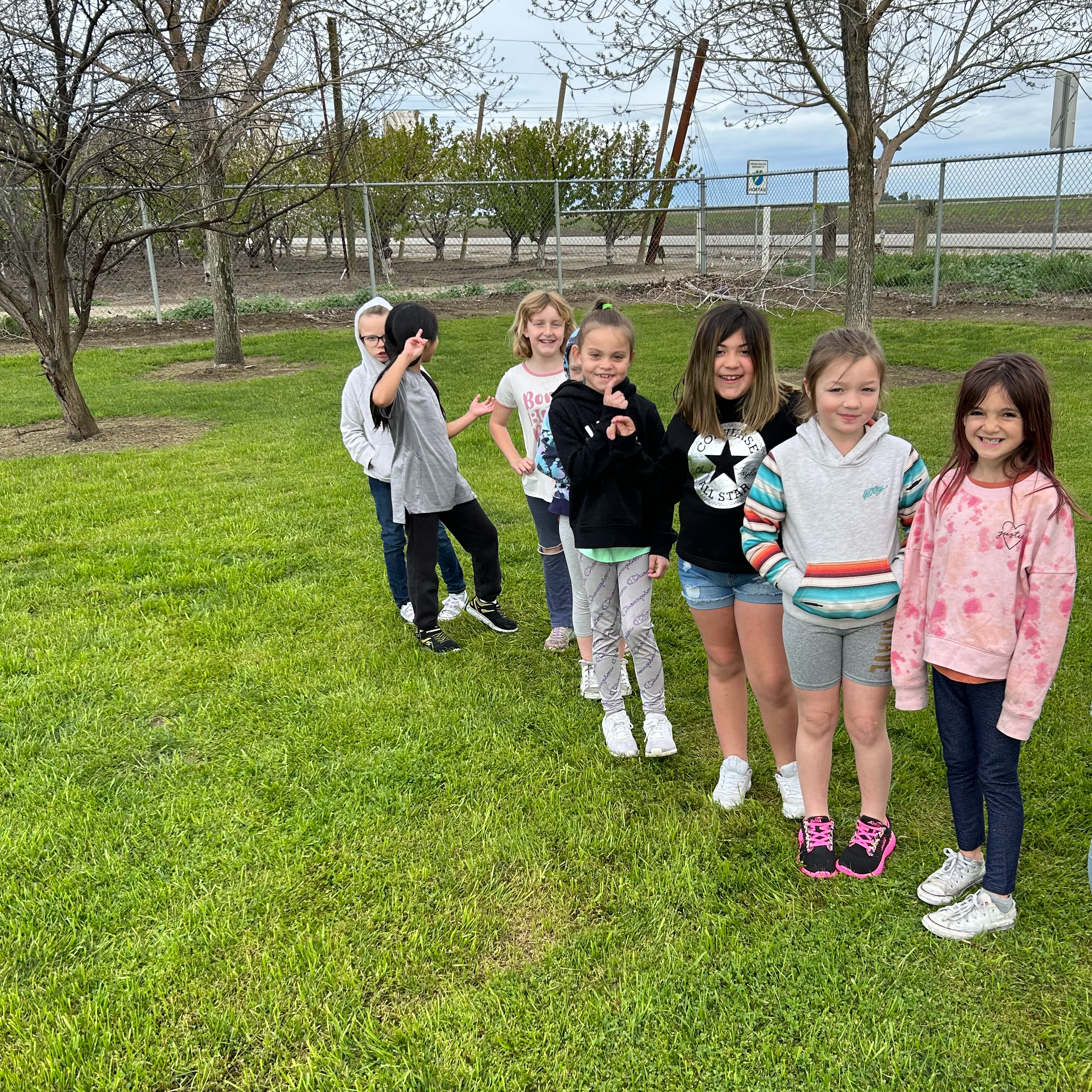 2nd grade in a line on a field