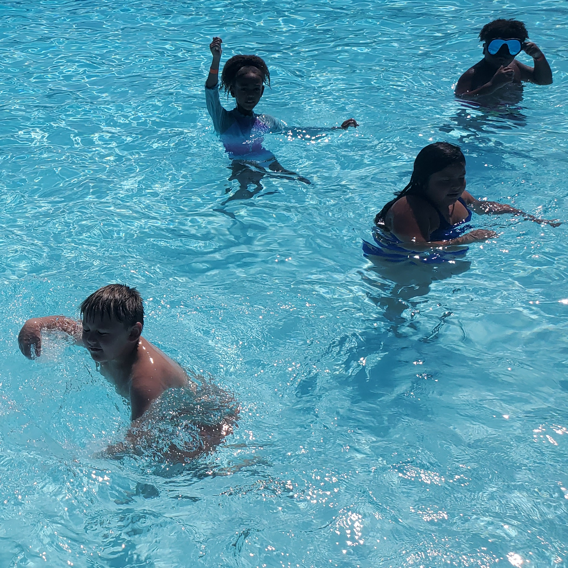 students swimming in pool