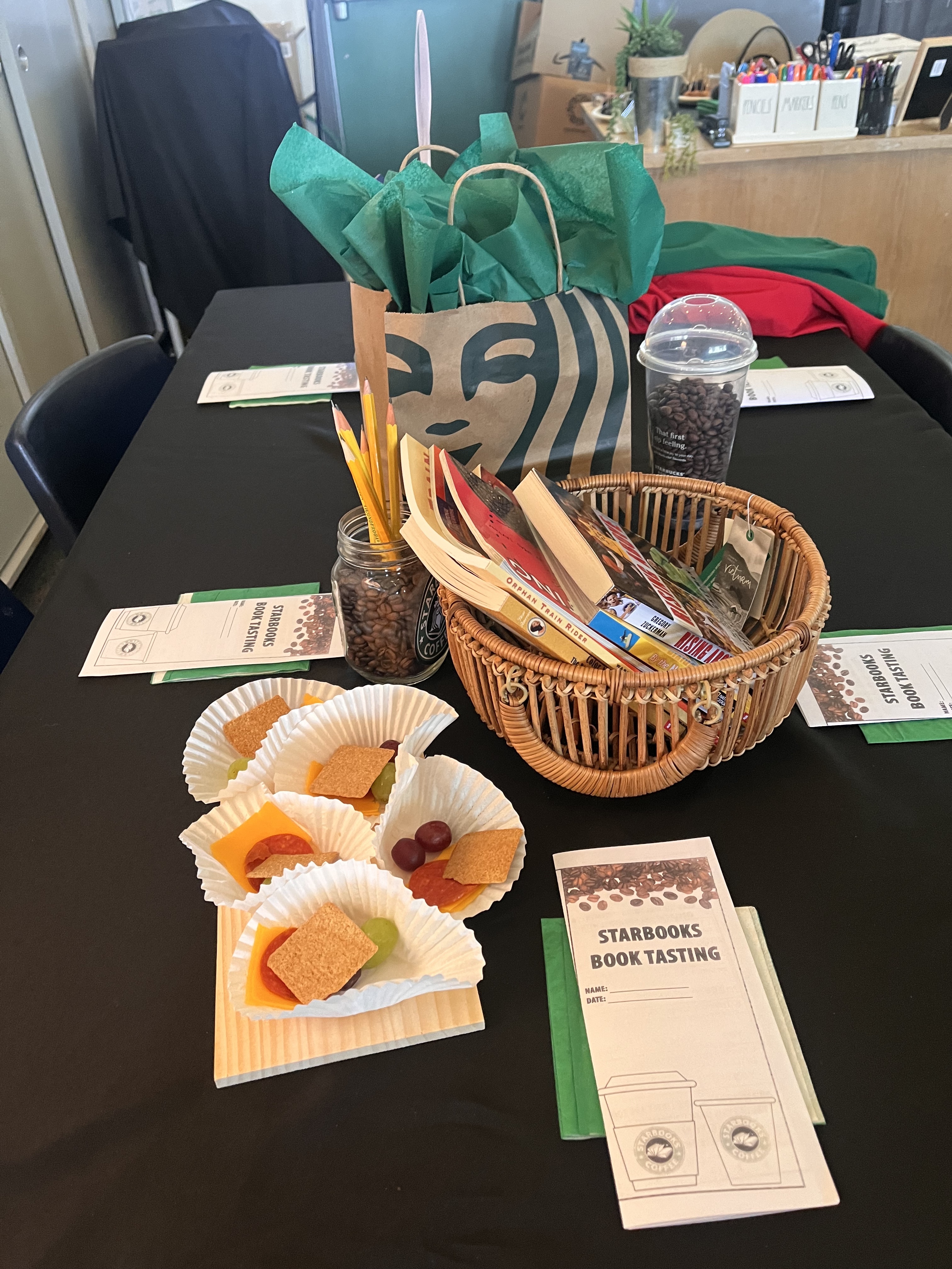 Table with snacks at book tasting event