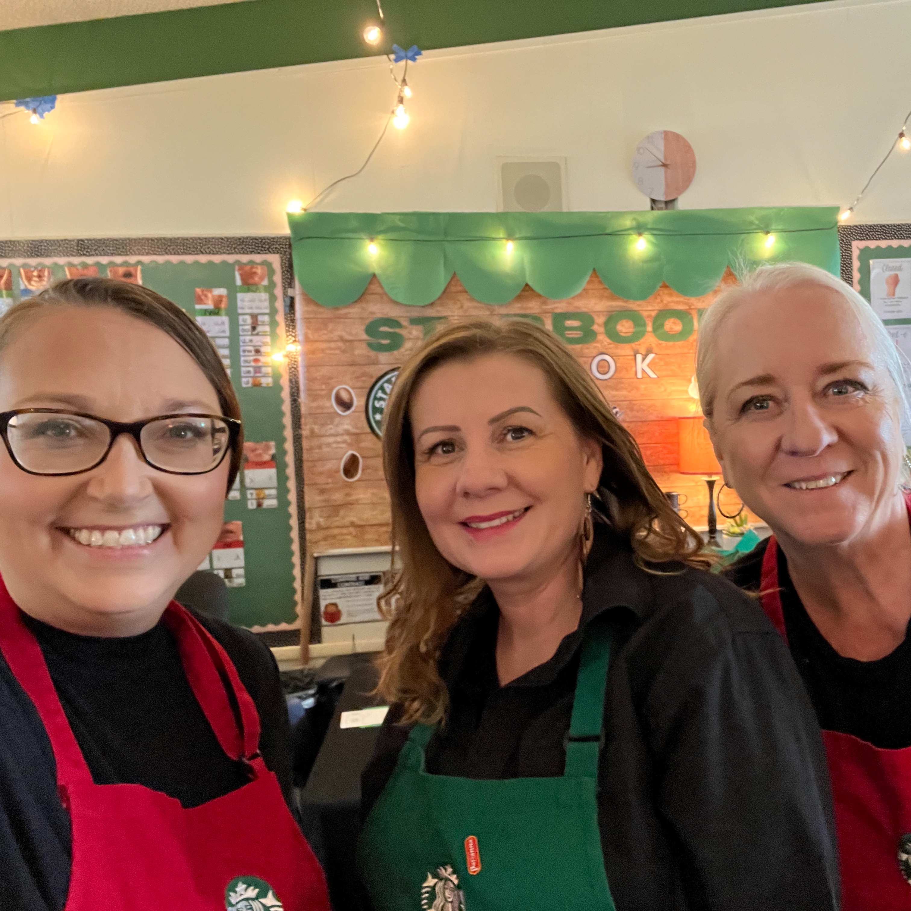 Mrs. Linnell, Mrs. J, and Mrs. Cindy at the book tasting event