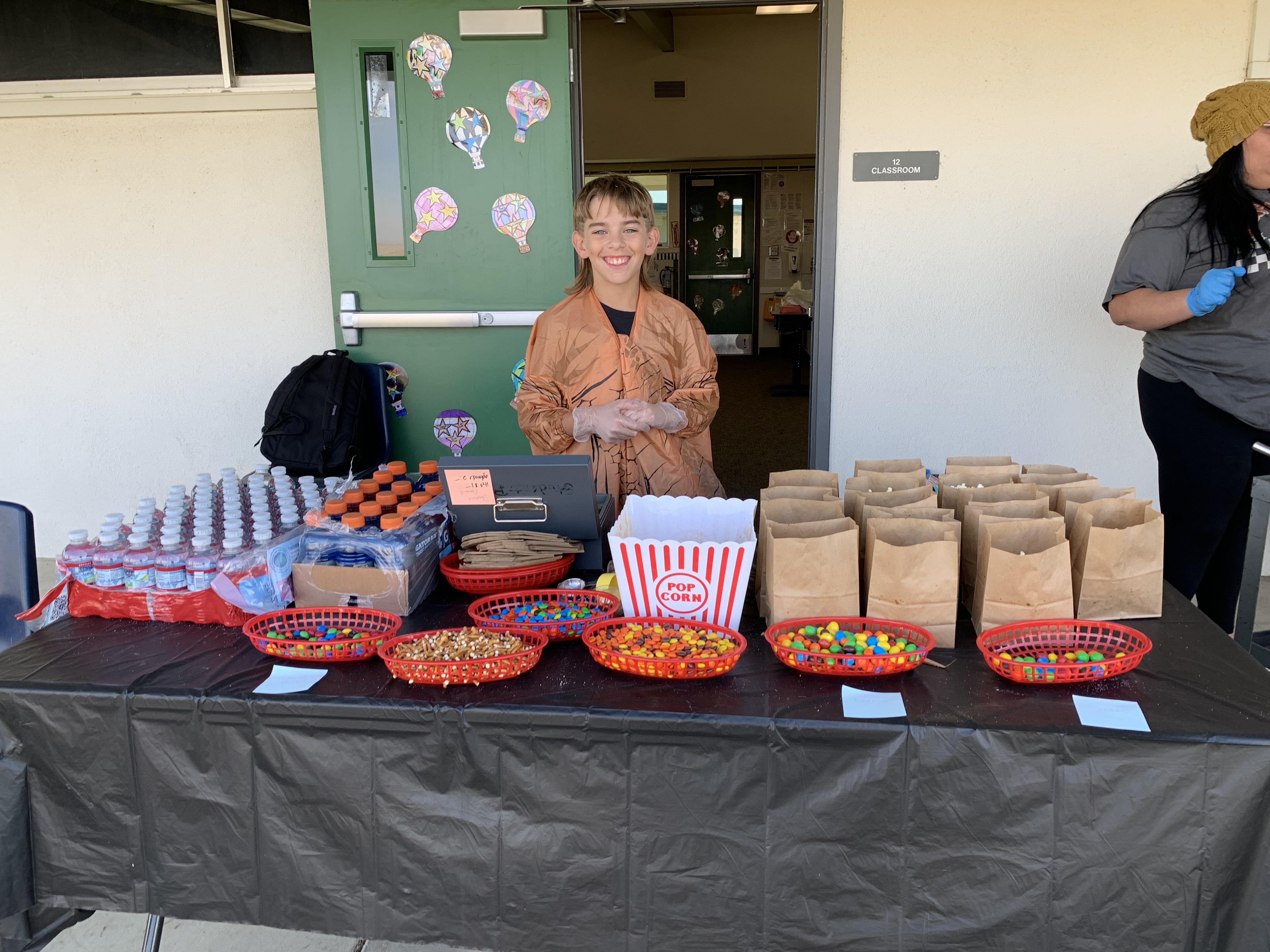 Student selling popcorn