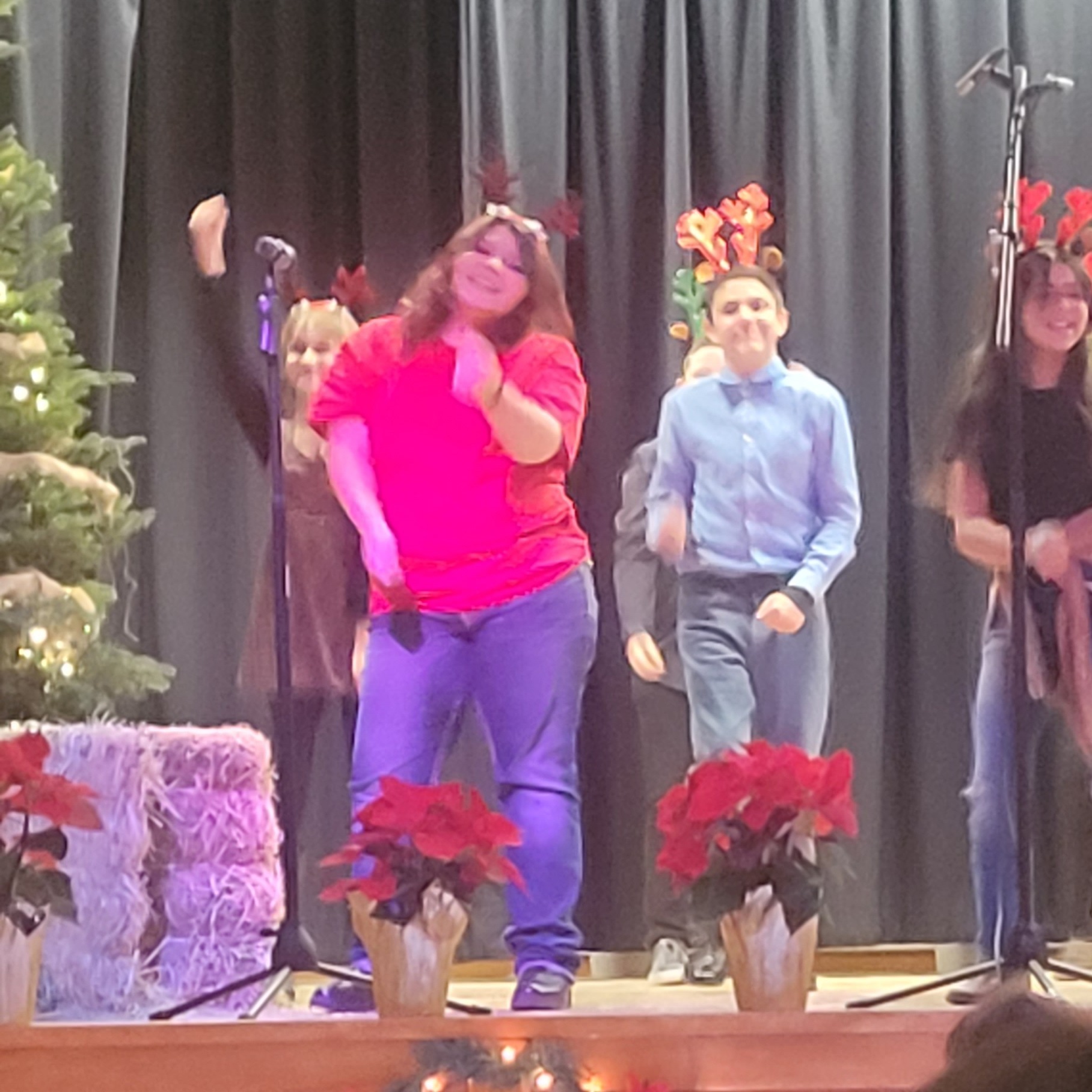 Sabrina Fuller, Mimi Guzman, Jarrot Vaughn, and Vicki Gutierrez performing in the Christmas Program