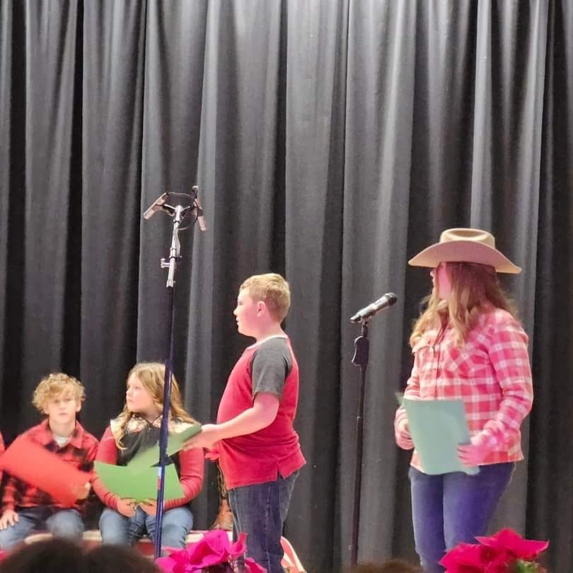 Aydyn Corkern, Cloie Thompson, Colton Robison, and Jaycie Craven performing in the Christmas Program. 