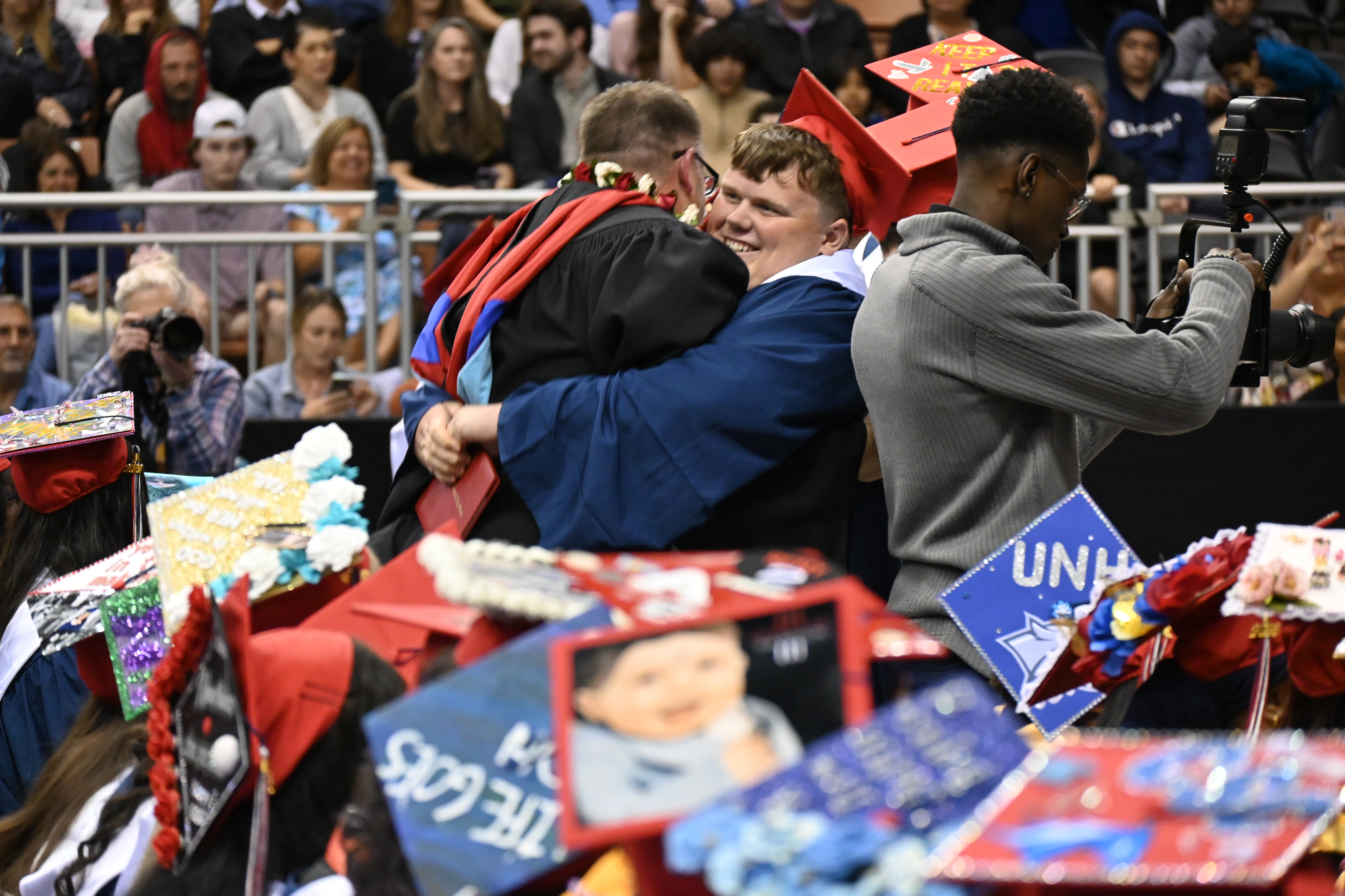 Memorial grad bear-hugs principal at 2023 graduation