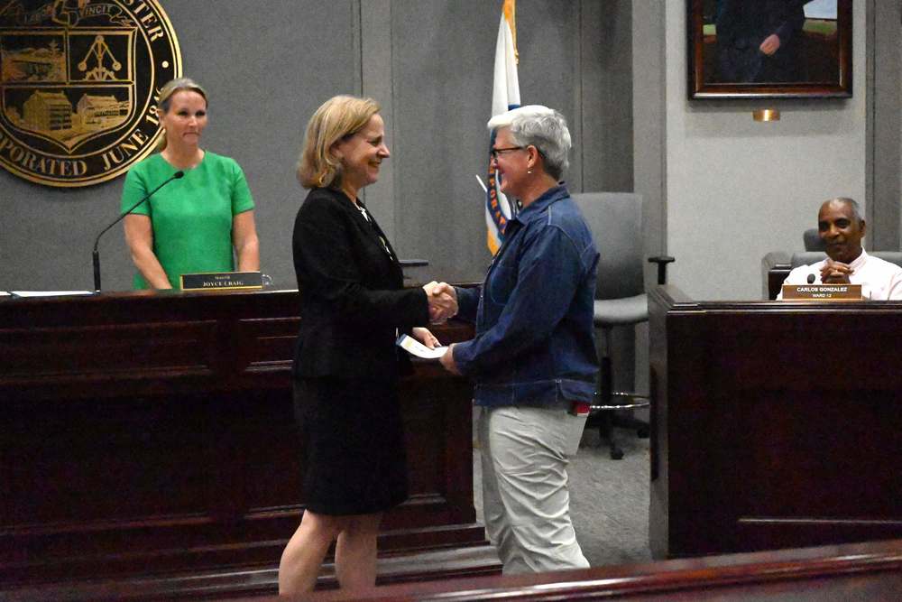 retiring teacher is recognized at board meeting