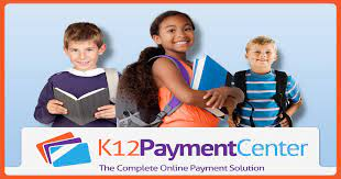 A girl and boy holding books smiling at the camera advertising K12PaymentCenter