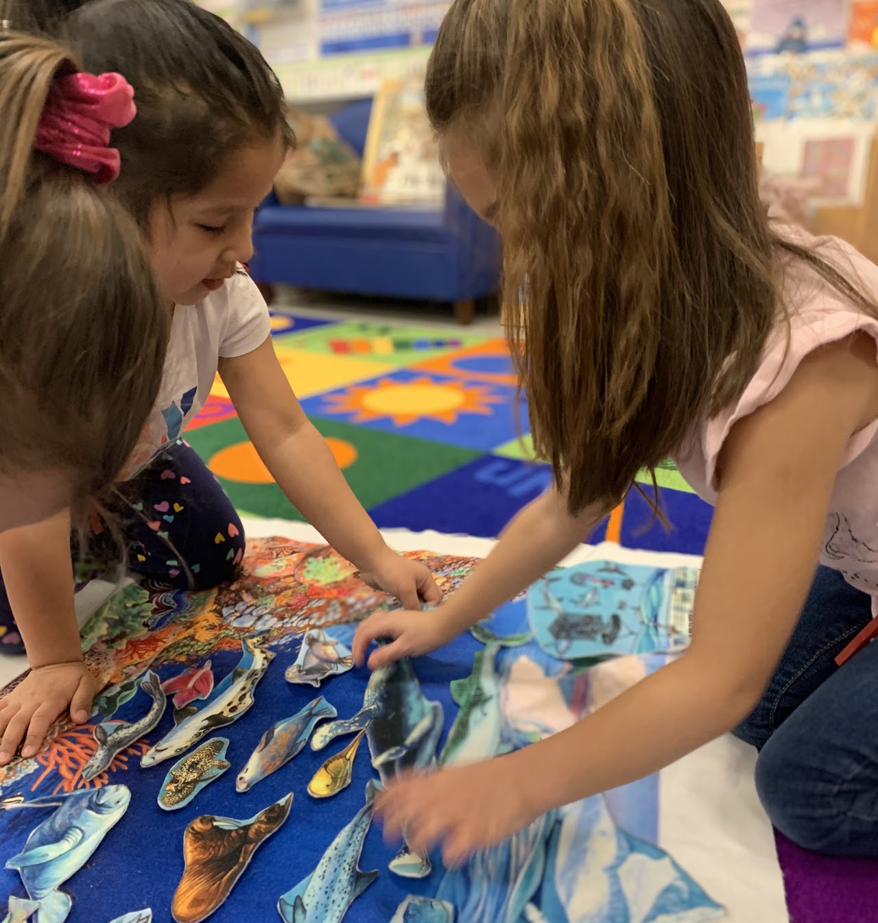 Pre-K students playing with toys