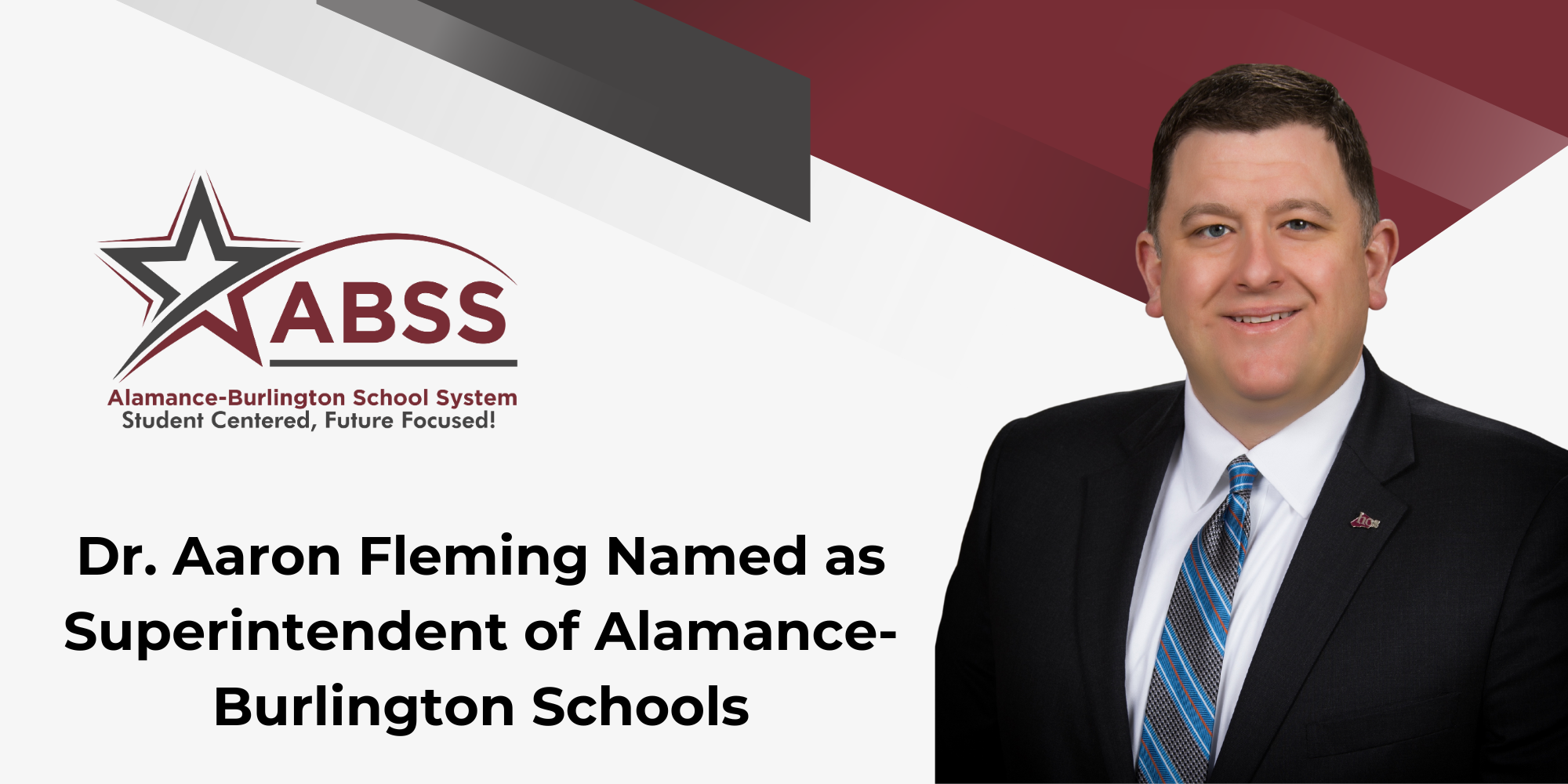 Graphic with maroon and gray stipes, a photo of Dr. Aaron Fleming in a black suit, and text Dr. Aaron Fleming Named as Superintendent of Alamance-Burlington Schools