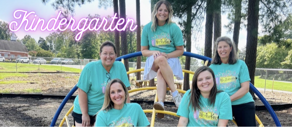 A group of smiling Kindergarten teachers.