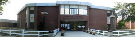 Photograph of the entrance to R. Andrews Elementary School during the day