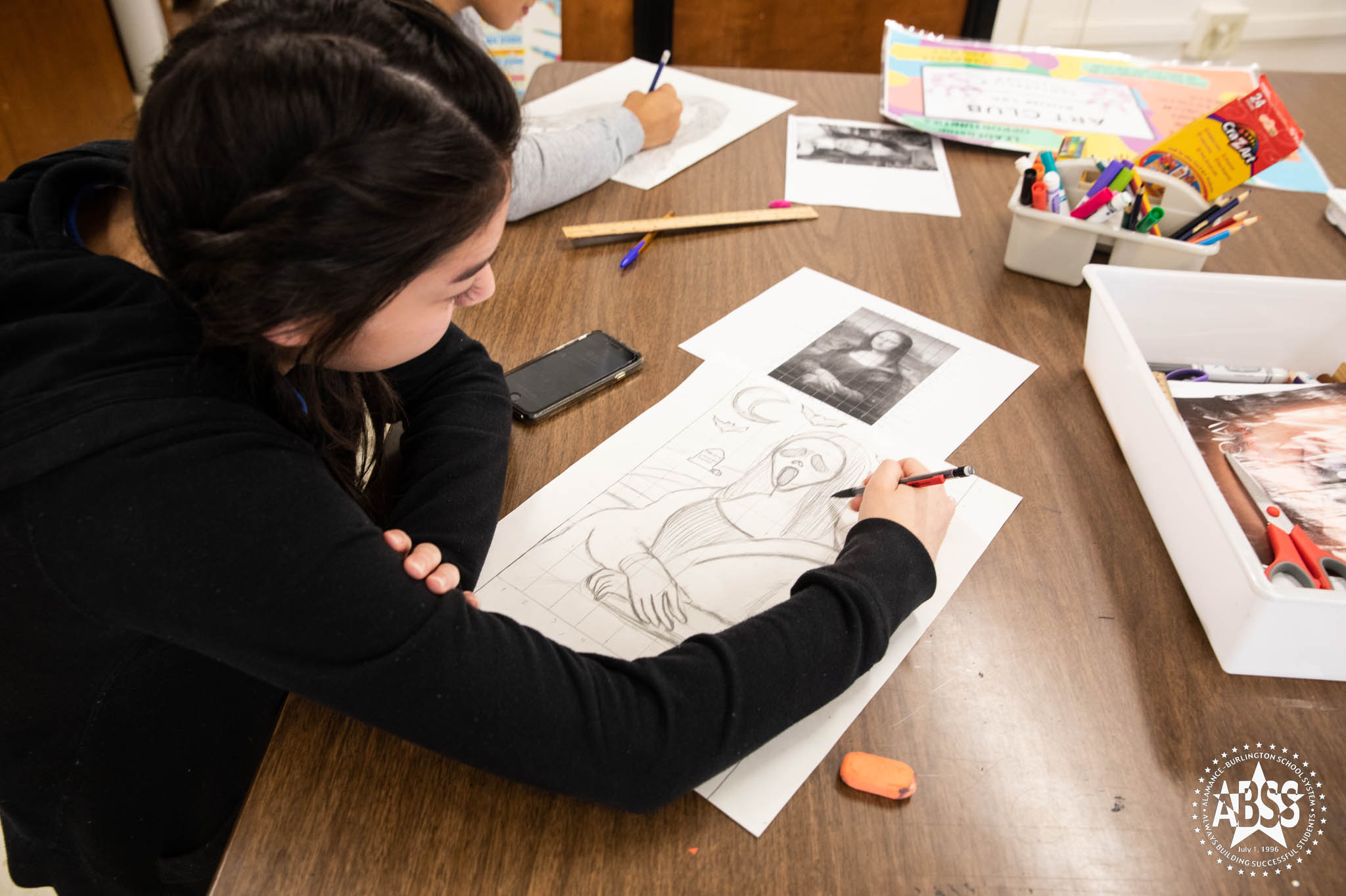 student in art class drawing Mona Lisa look alike 