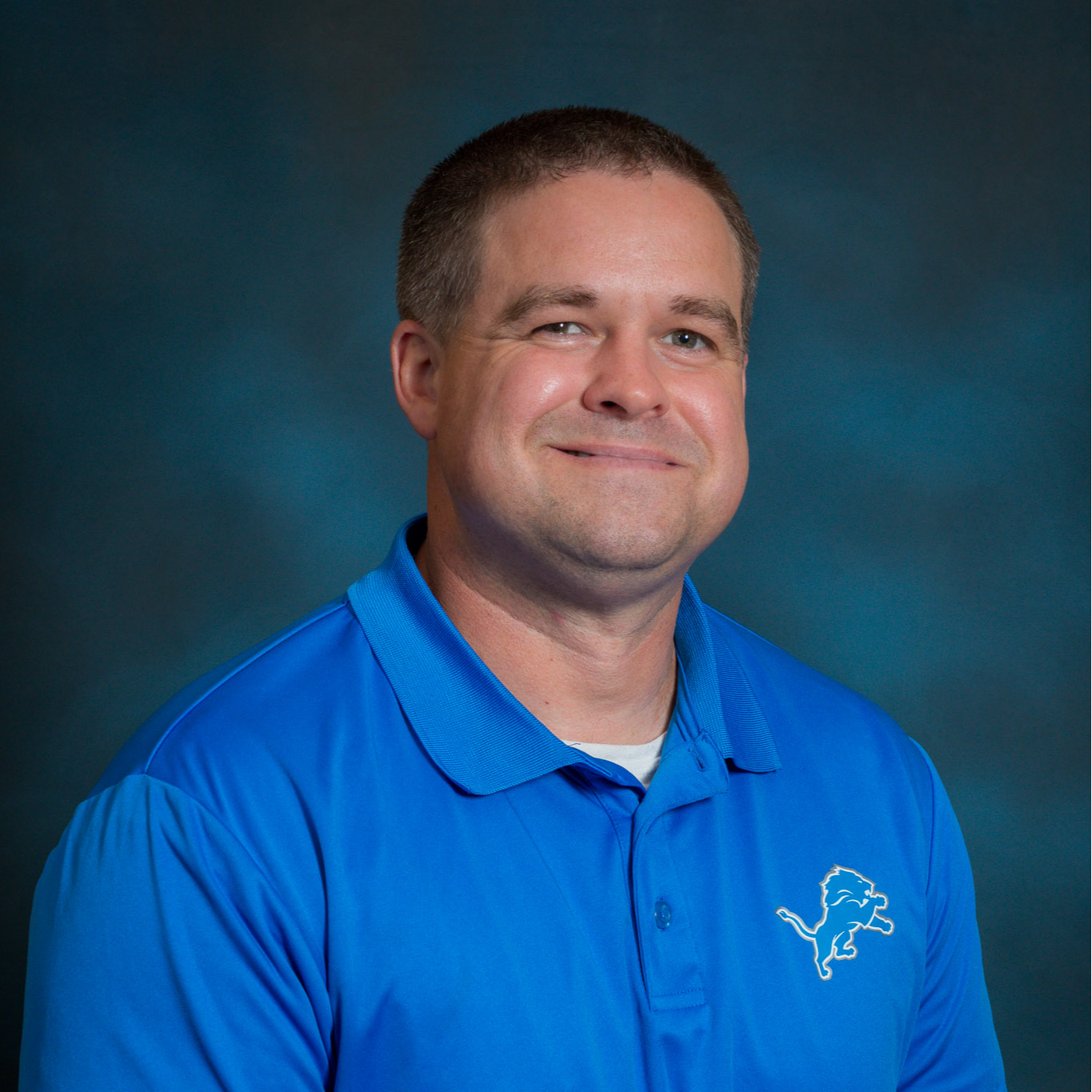Portrait of Scott Moore wearing a blue polo shirt