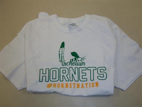 White t-shirt with green Inchelium Hornets and yellow #Hornetnation
