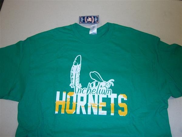 Green t-shirt with white and yellow logo and Inchelium Hornets