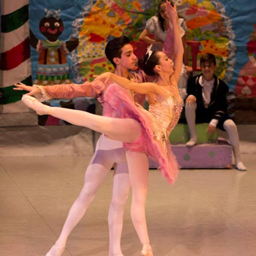 Two students dancing on stage. 