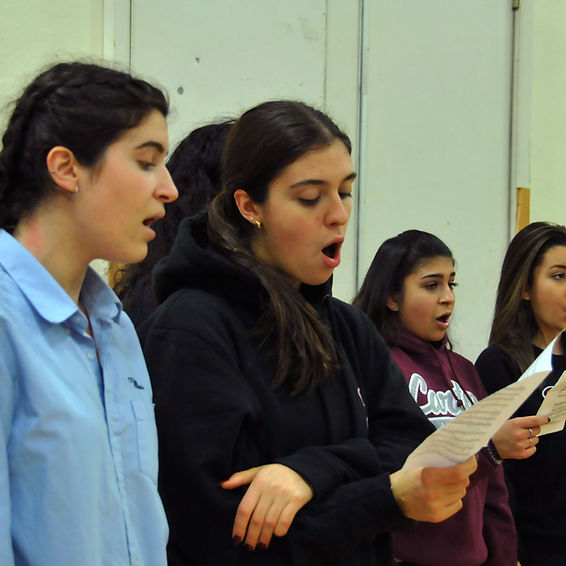 3 female students practicing vocal.