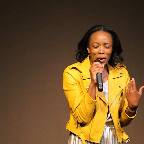 A female performing a song.