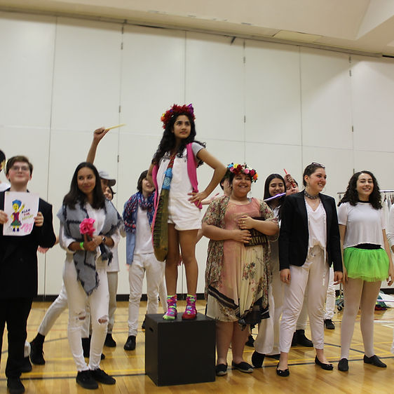 A group of students finishing a show.