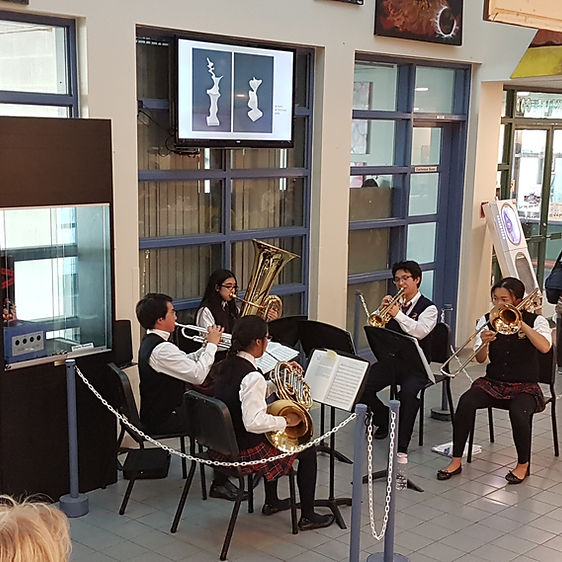 A group of students playing strings instruments. 