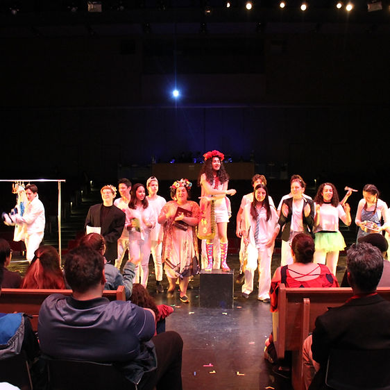 A group of students performing a show on stage.