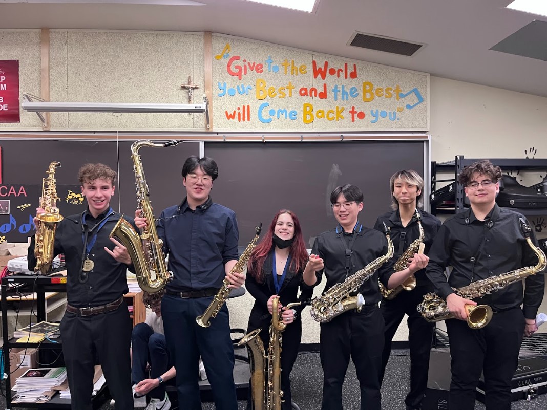 students posing with saxophones