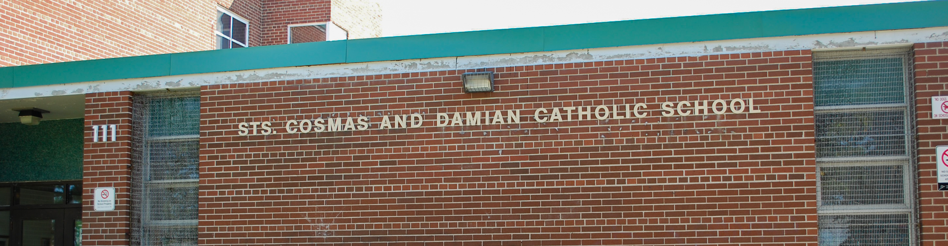 The front of the Sts. Cosmas and Damian Catholic School building.