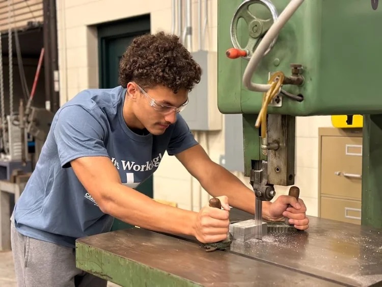 CTE student learning how to operate equipment.