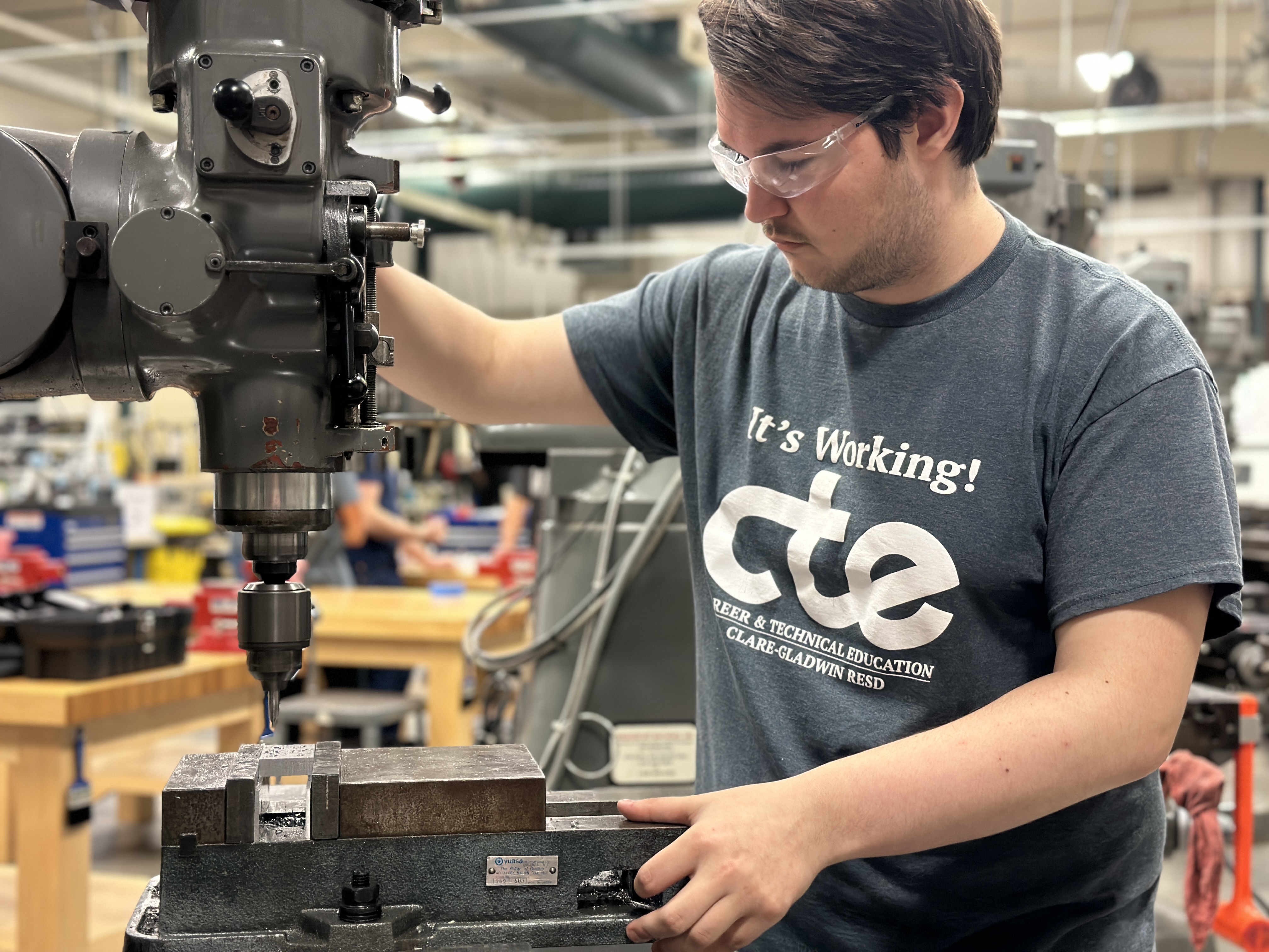 Advanced Manufacturing student working on equipment