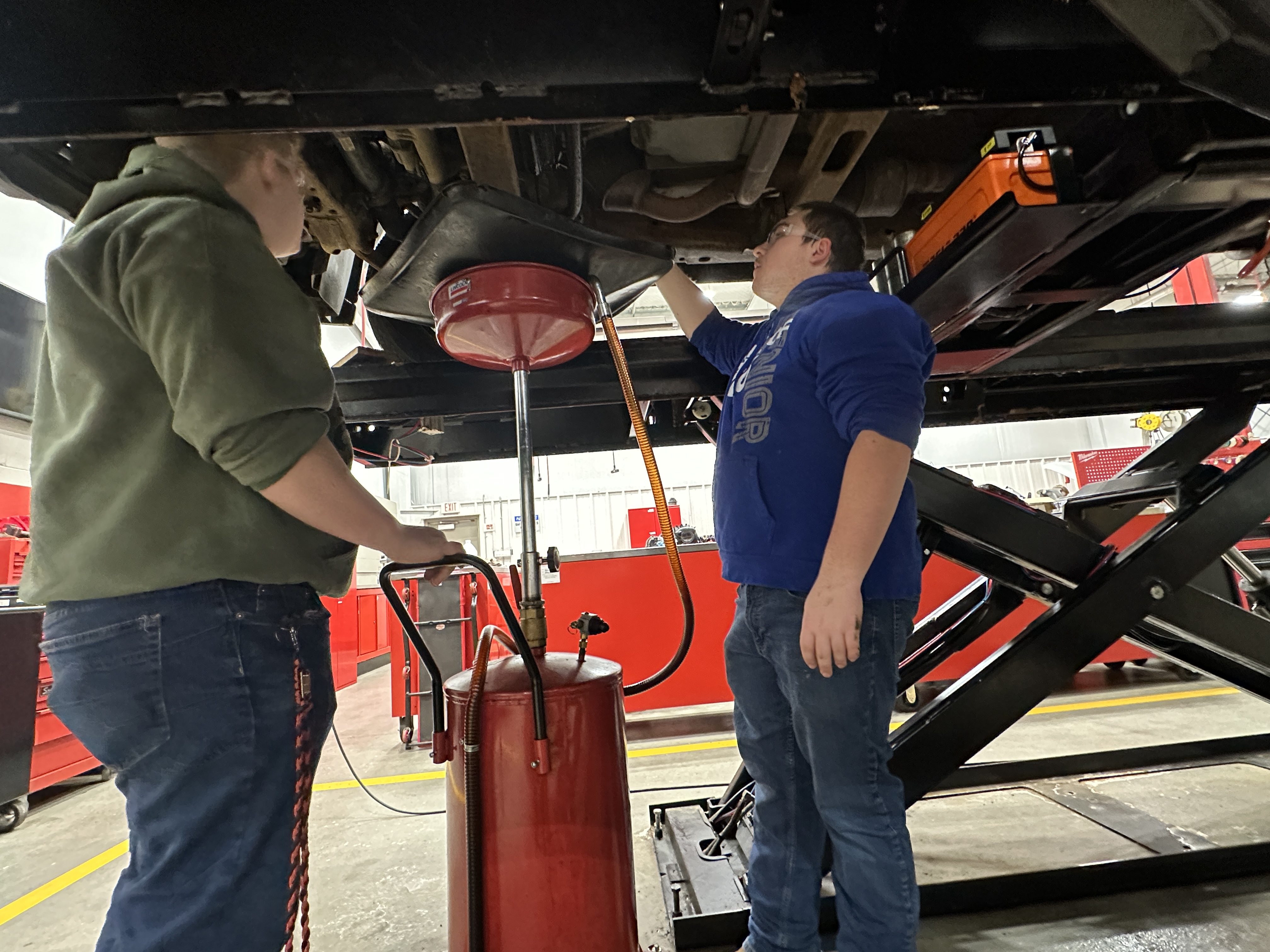 Automotive Technology Students working on engine
