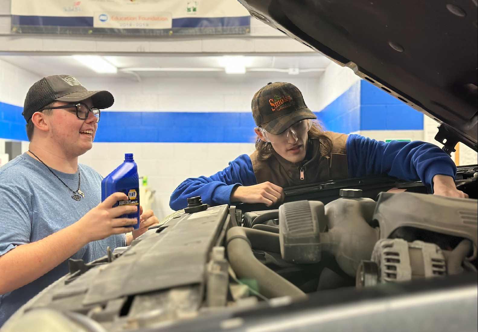 Auto Students working on engine
