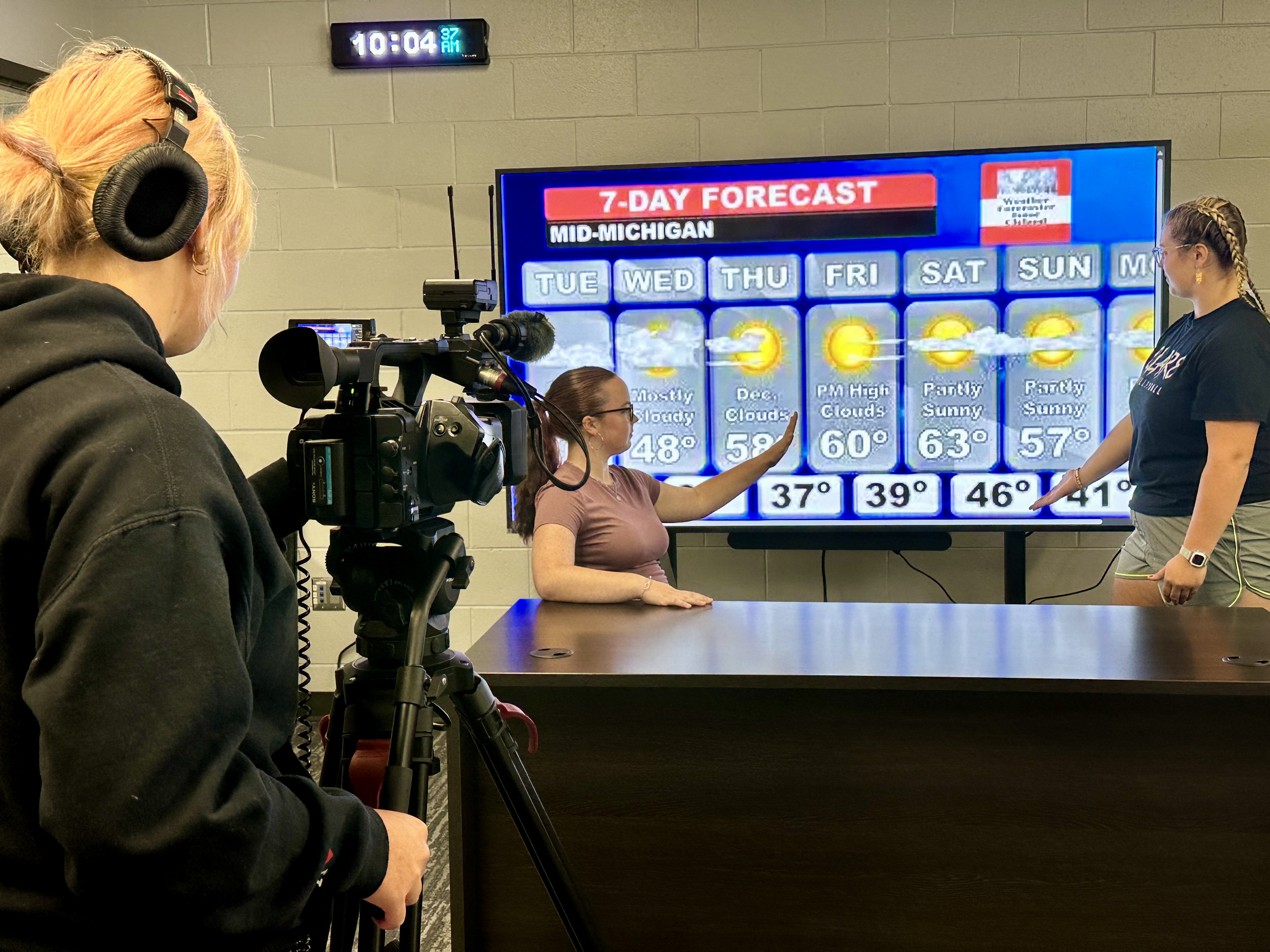 Digital Media students filming weather report