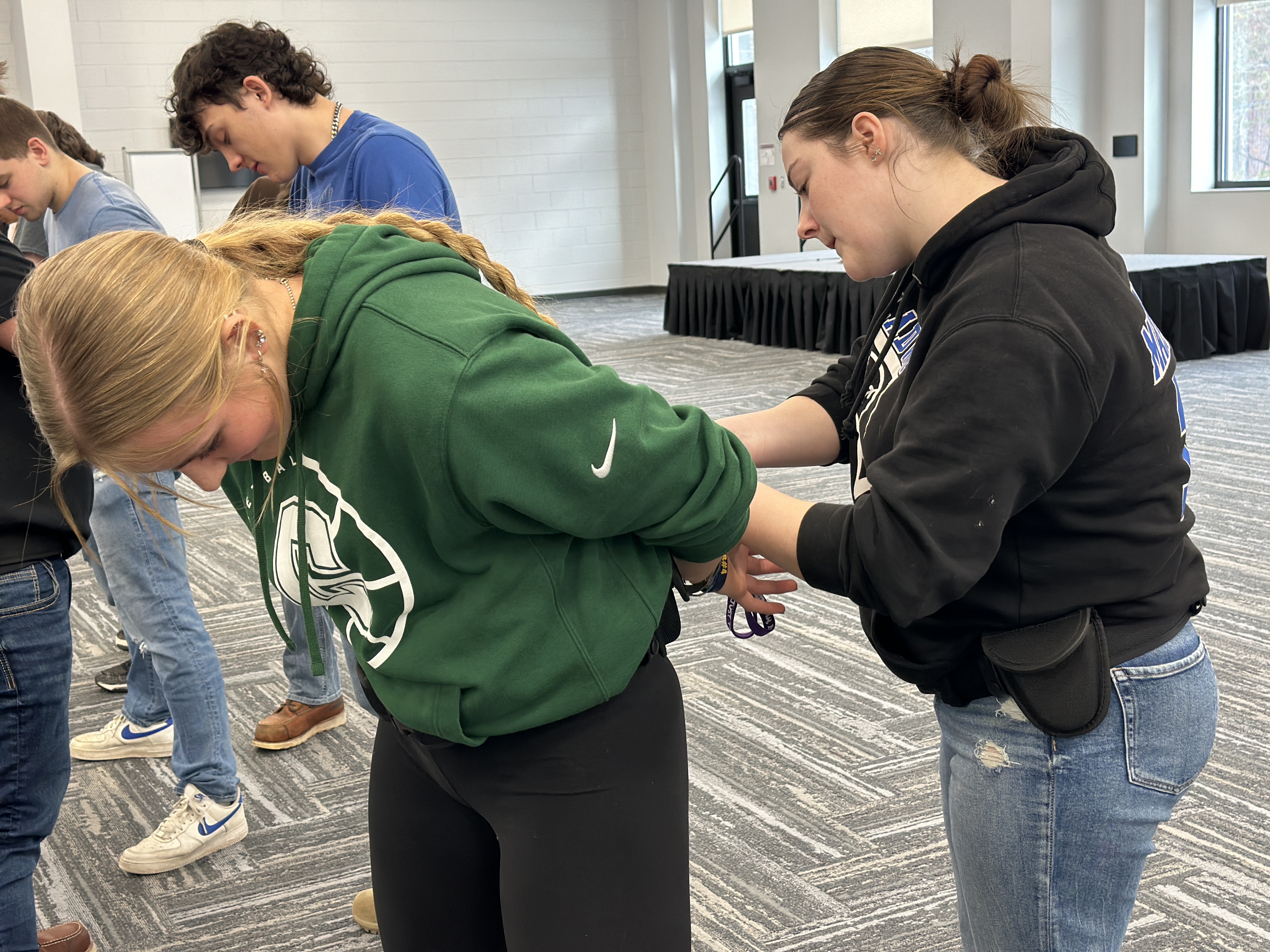 Students practicing Handcuffing
