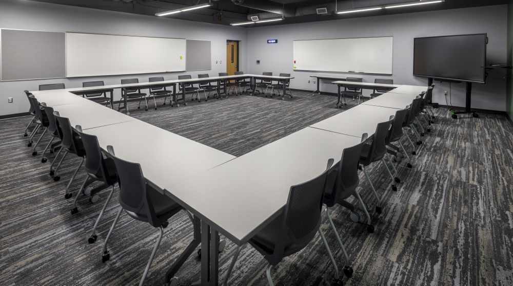 Small Meeting room at CTE. tables in square shape.