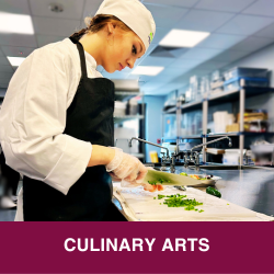CULINARY ARTS STUDENT CHOPPING  VEGTABLES