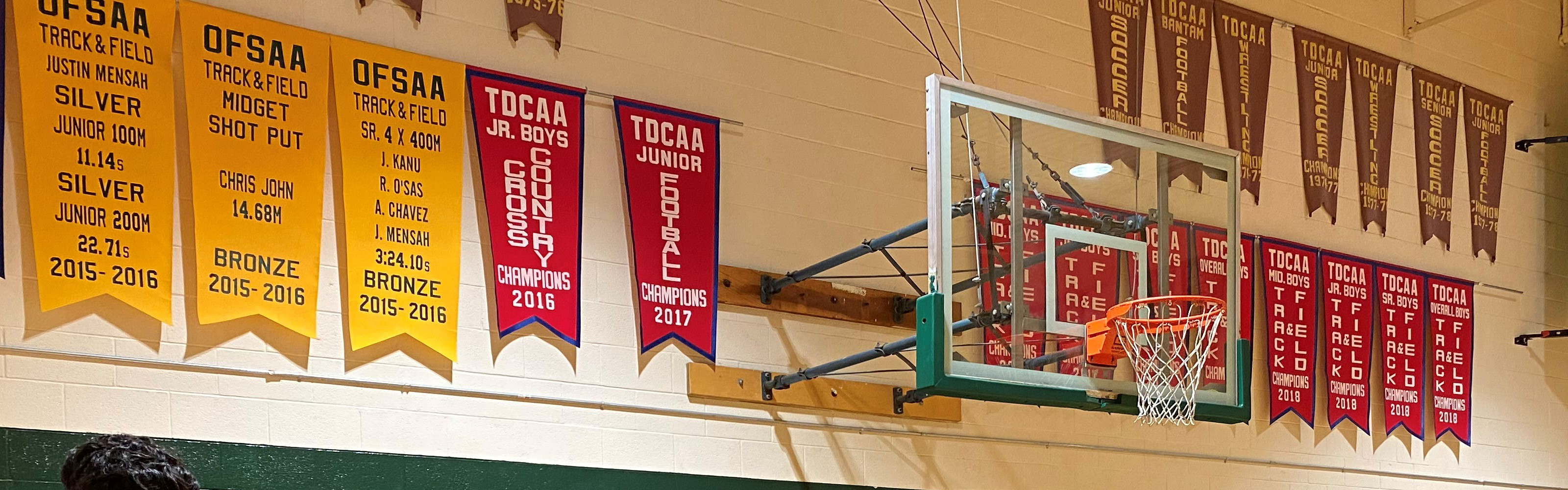 Photo of school gym with championship banners