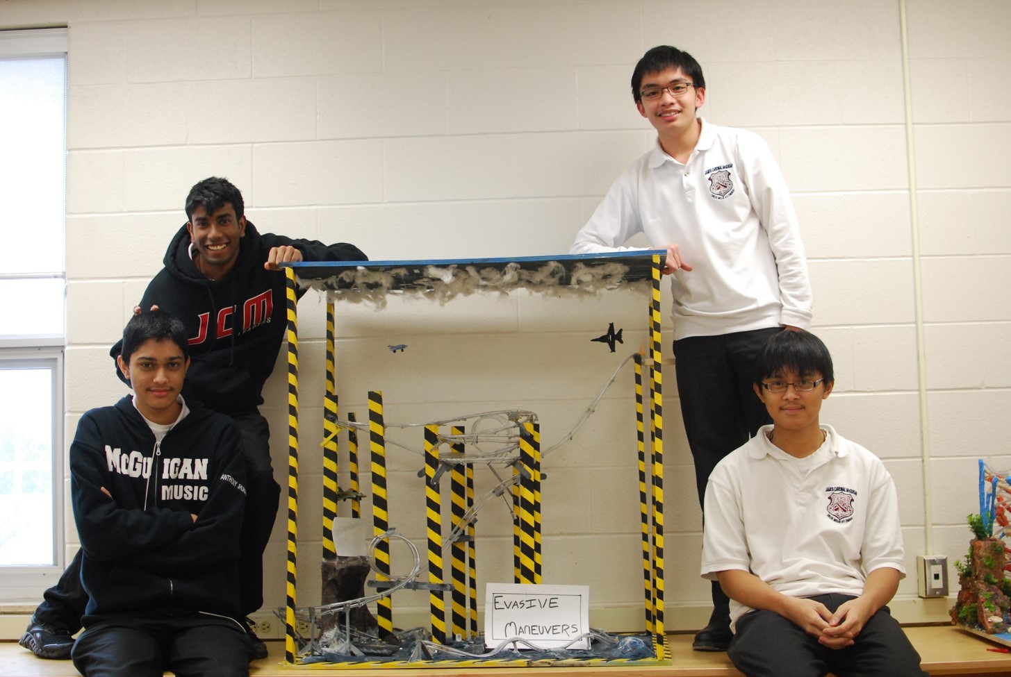 Students posing with science project
