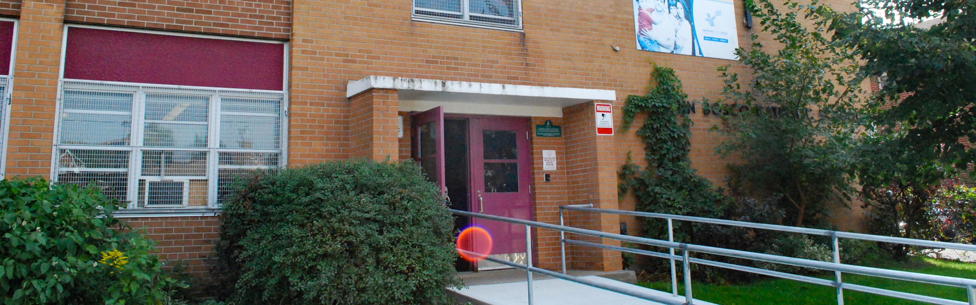 The front of the St. John Bosco Catholic School building.