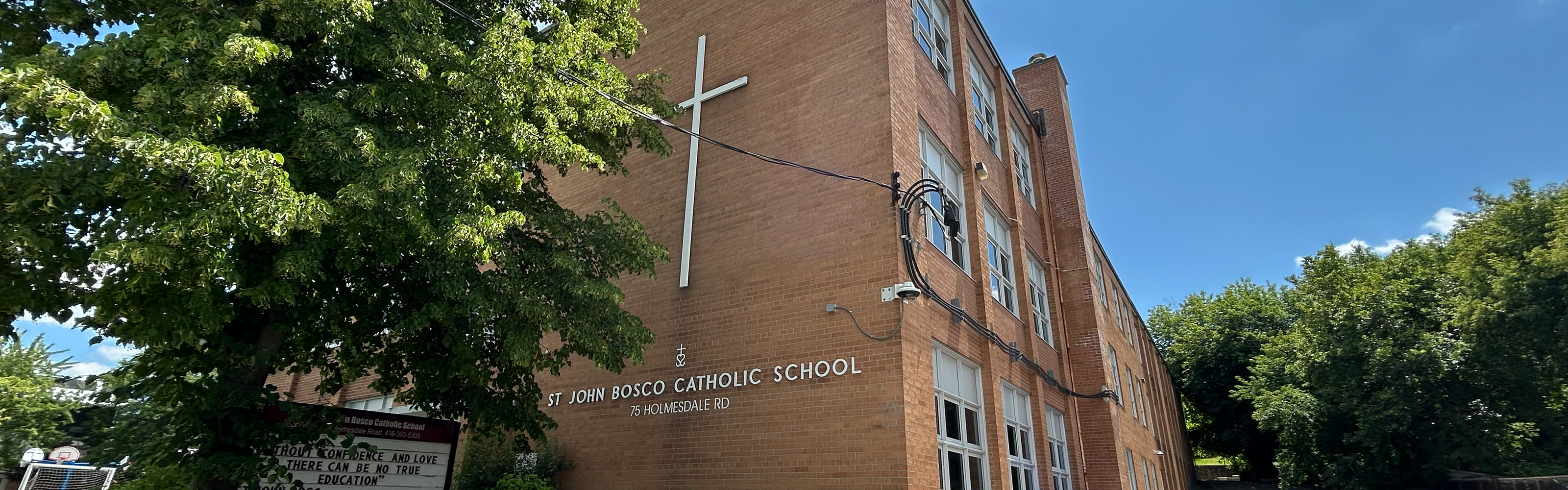 The front of the St. John Bosco Catholic School building.
