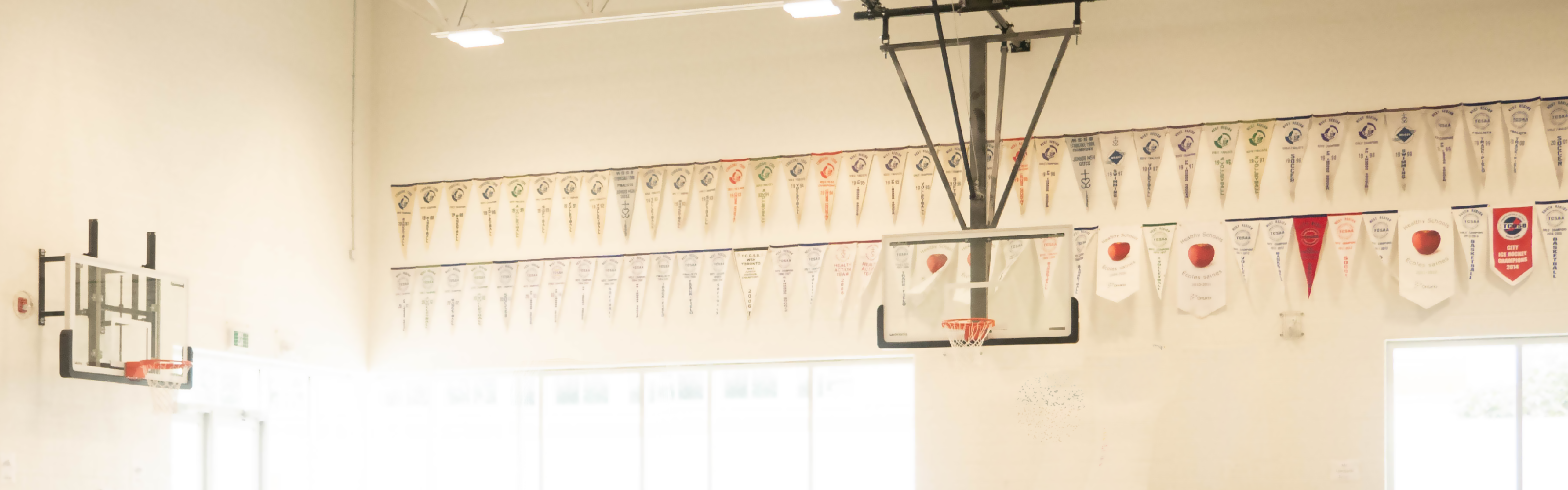 School gym with championship banners hung on the walls
