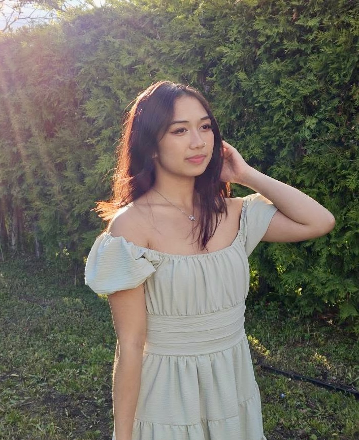 An image of a woman smiling.