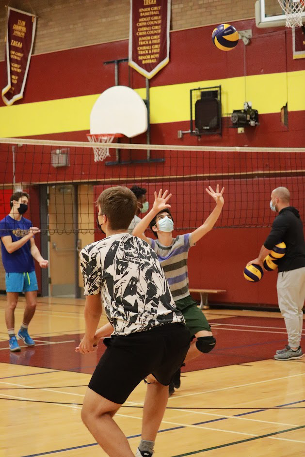Senior boys volleyball team playing in the gym
