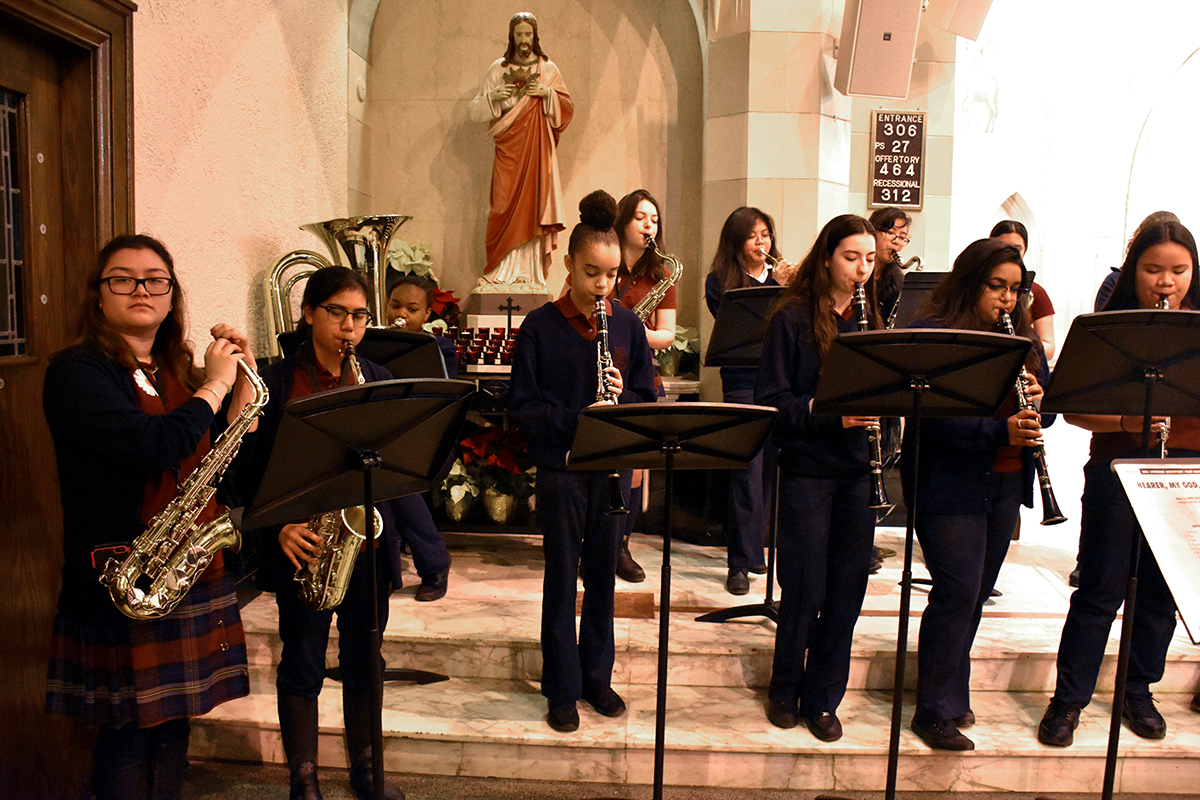 Notre Dame music students playing instruments in church