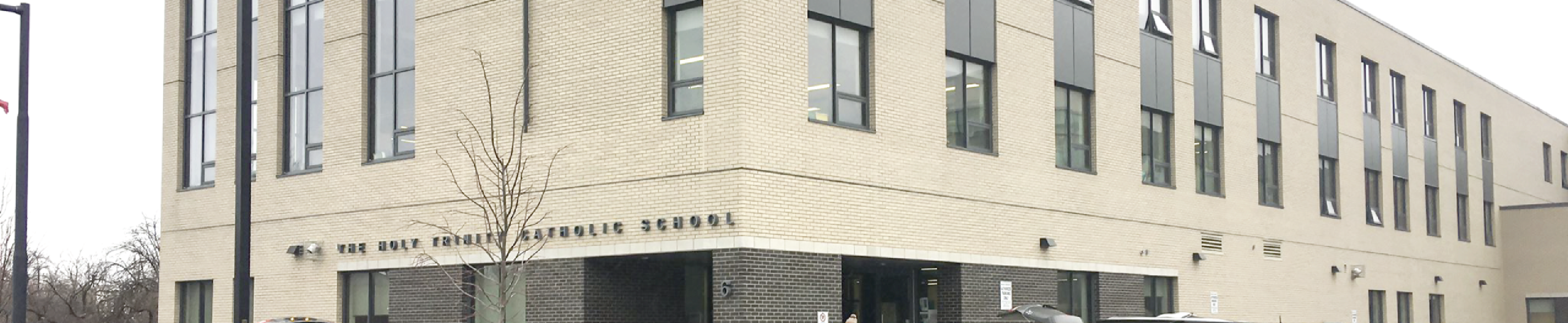 A photo of the front entrance of the Holy Trinity Catholic School.