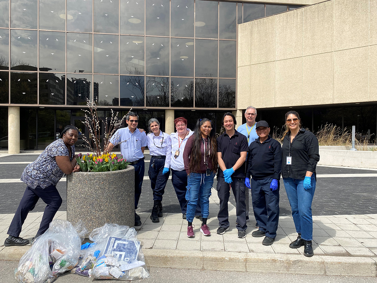 (Catholic Education Center) staff cleaning up the area in front of the CEC office building.