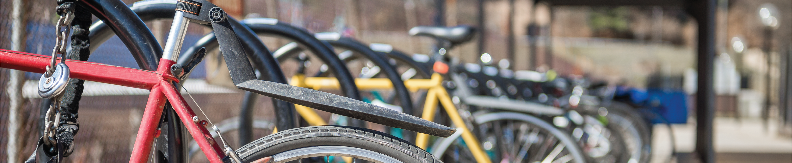 An image consists of bikes and bike rack.
