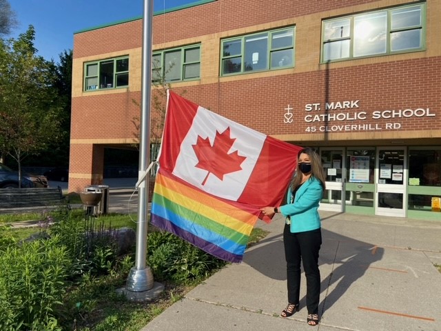 Principal Van Dinter Raises the Pride Flag at St. Mark Catholic School.