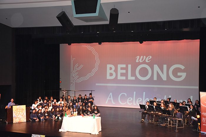 Two groups of students on stage at the we Belong Launch Celebration
