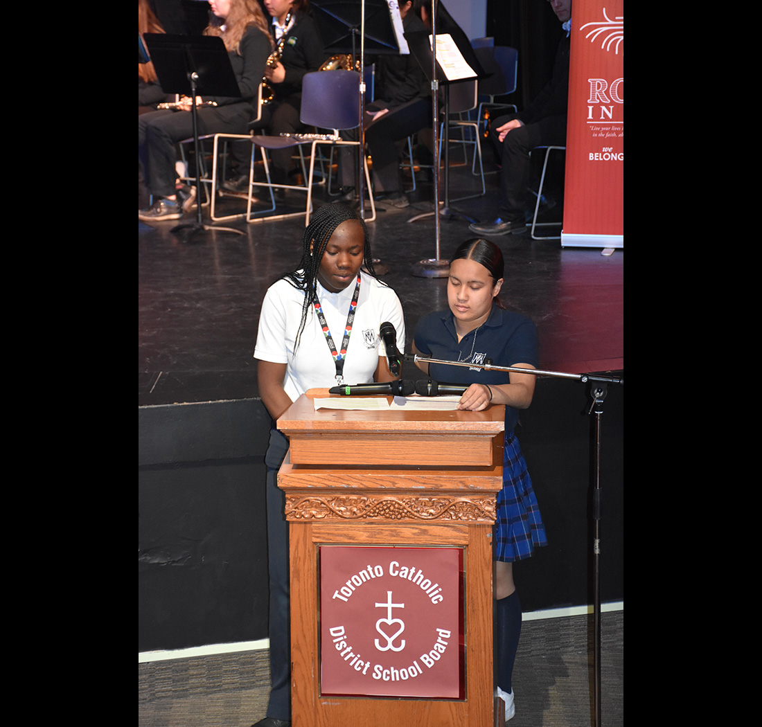 Two students speaking at a podium at the we Belong Launch Celebration