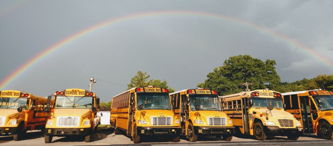 The bus yard with a rainbow