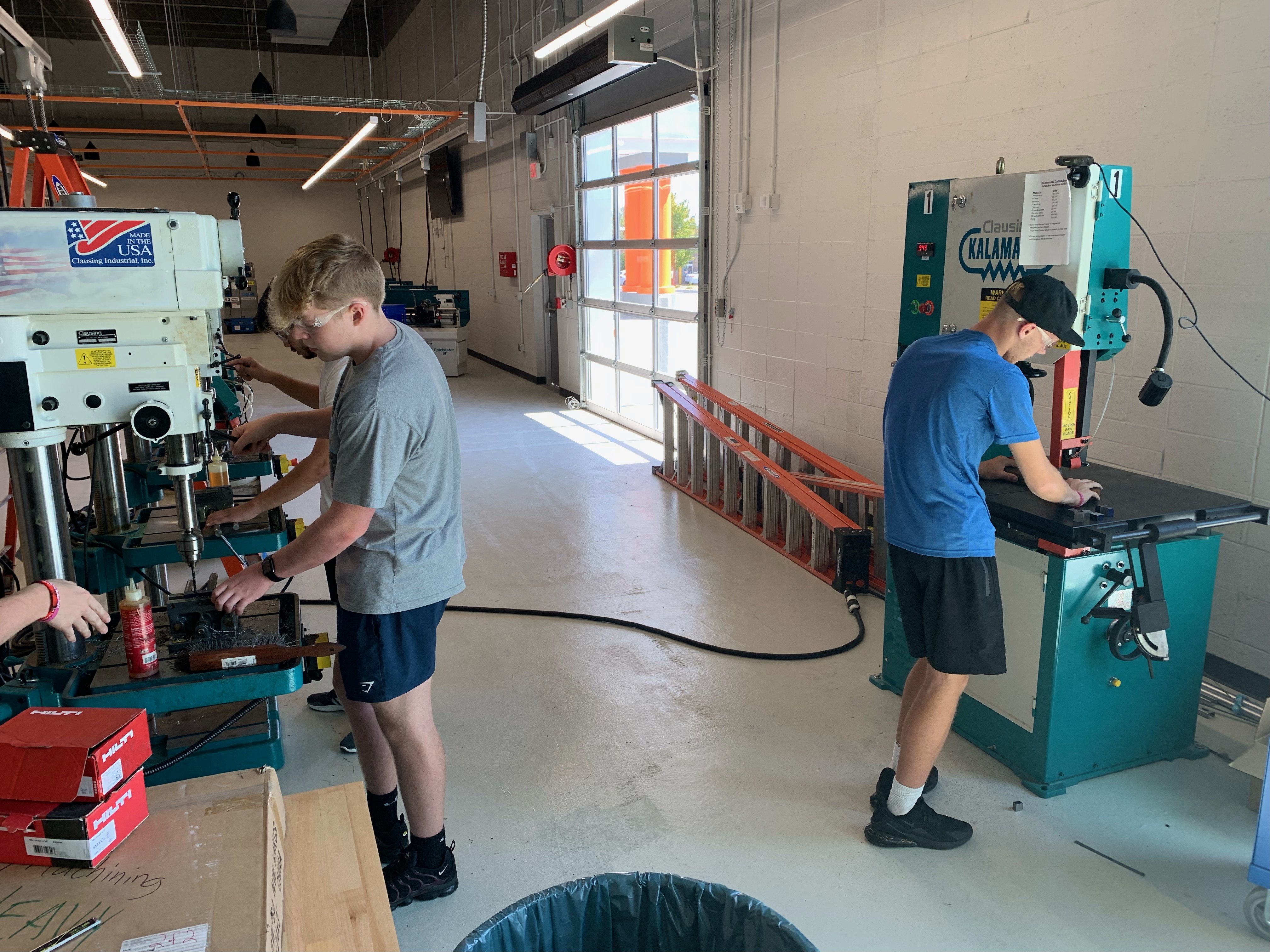 Students using machining equipment
